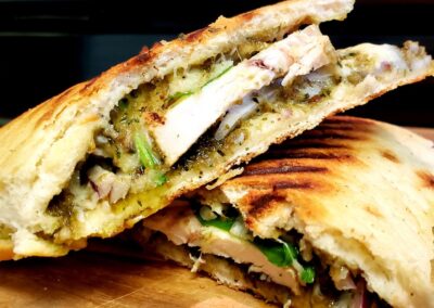 Marco Polo Panini (Grilled Chicken Breast, Red Onions, Parmesan, Housemade Pesto, Lemon Thyme Aioli)